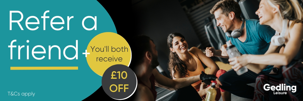 refer a friend and get £10 off. Image of a group of people laughing together in a gym setting